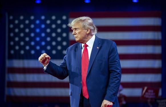 Former President Donald Trump pumps his fist as he departs after speaking at the Conservative Political Action Conference, CPAC 2023, Saturday, March 4, 2023, at National Harbor in Oxon Hill, Md. (AP  ...